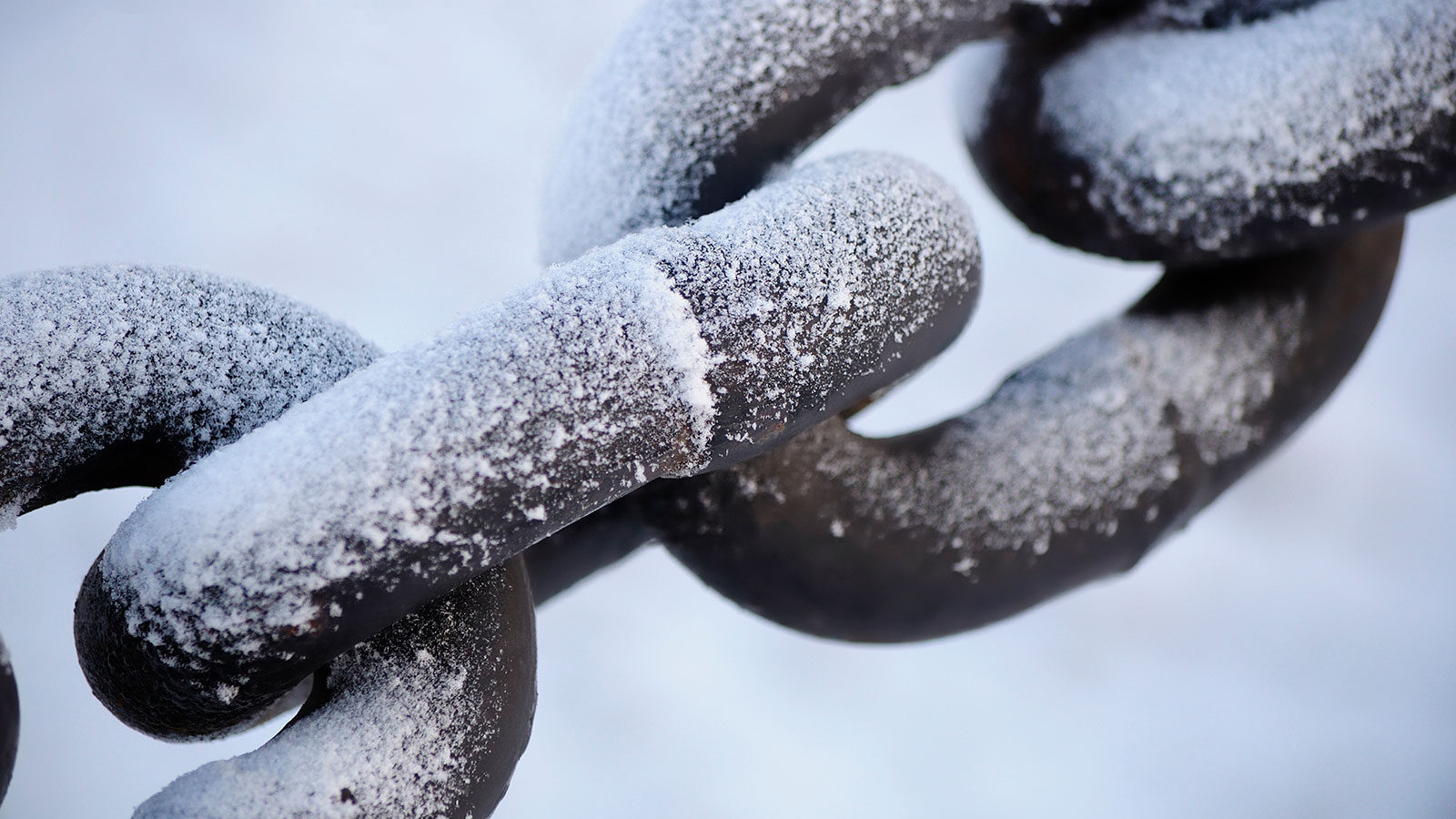 Steel chains covered in snow
