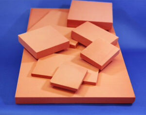 ThermaBrick bricks in a wide variety of shapes and sizes stacked on top of one another. 