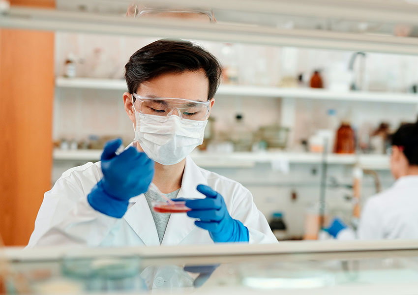 Man evaluating fluids in a laboratory